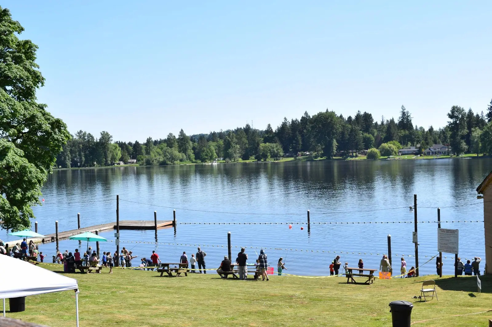Families gathered along the lakeshore and dock for fishing at Columbus Park